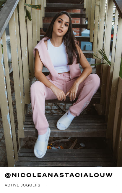 a female Mr Price influencer in pink active joggers