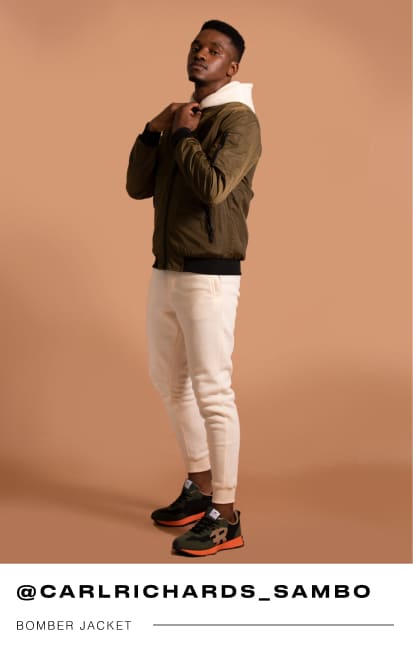 a male Mr Price influencer in a brown bomber jacket with a cream hood