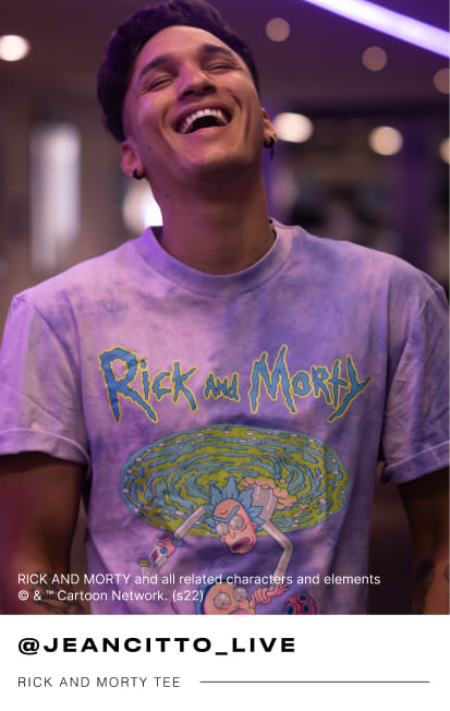 a male Mr Price influencer wearing a purple Rick and Morty tee