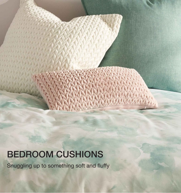 Shop scatter and bolster scatter bedroom cushions.