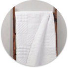 Add warmth and texture to your bedroom or lounge with our cozy throws and quilts.
