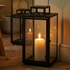 Scented candles and modern candle holders to create a relaxing atmosphere