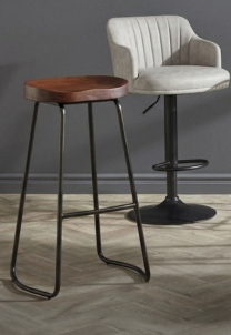 Industrial-style bar stools with black metal frames and tan faux leather padded seats.