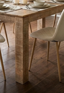 Large 6-seater oak-style dining table with sturdy trestle legs for family meals.