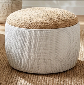 Round textured grey fabric ottoman and velvet seating cubes for versatile living room styling.