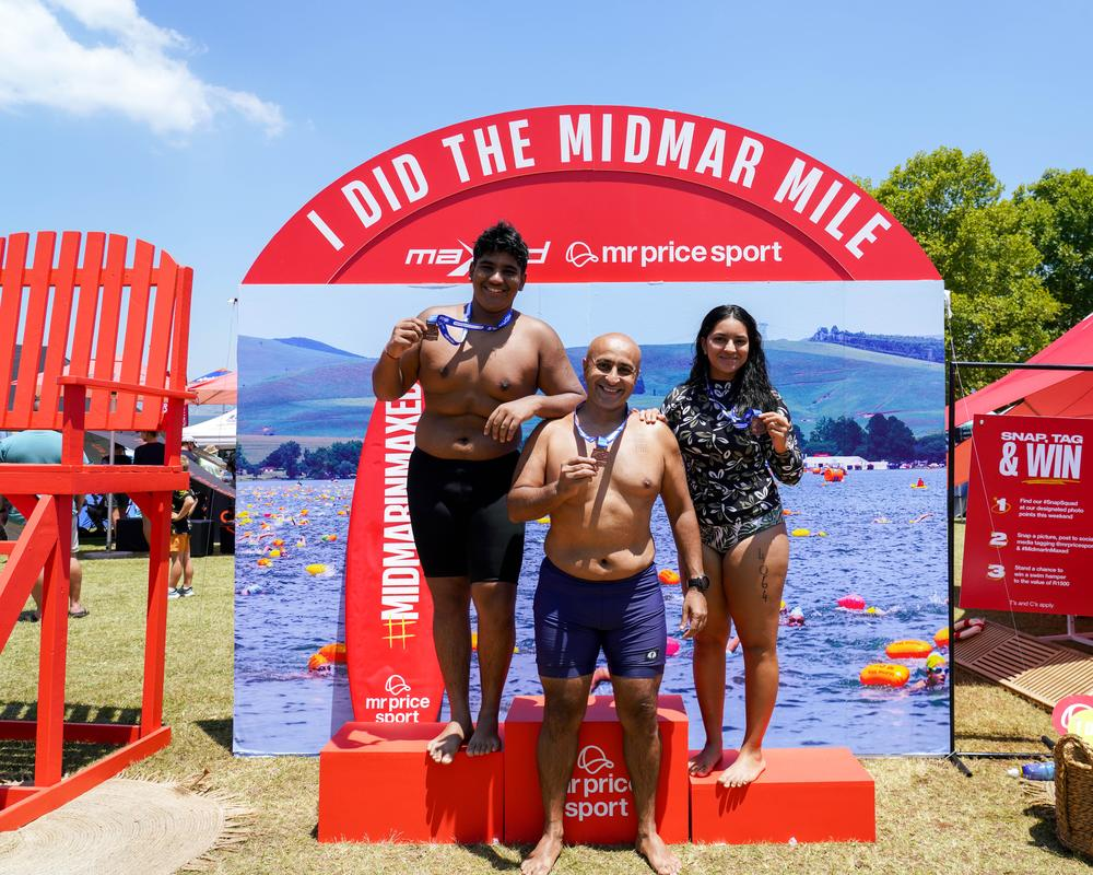 Three finishers with medals on the MRP Sport podium